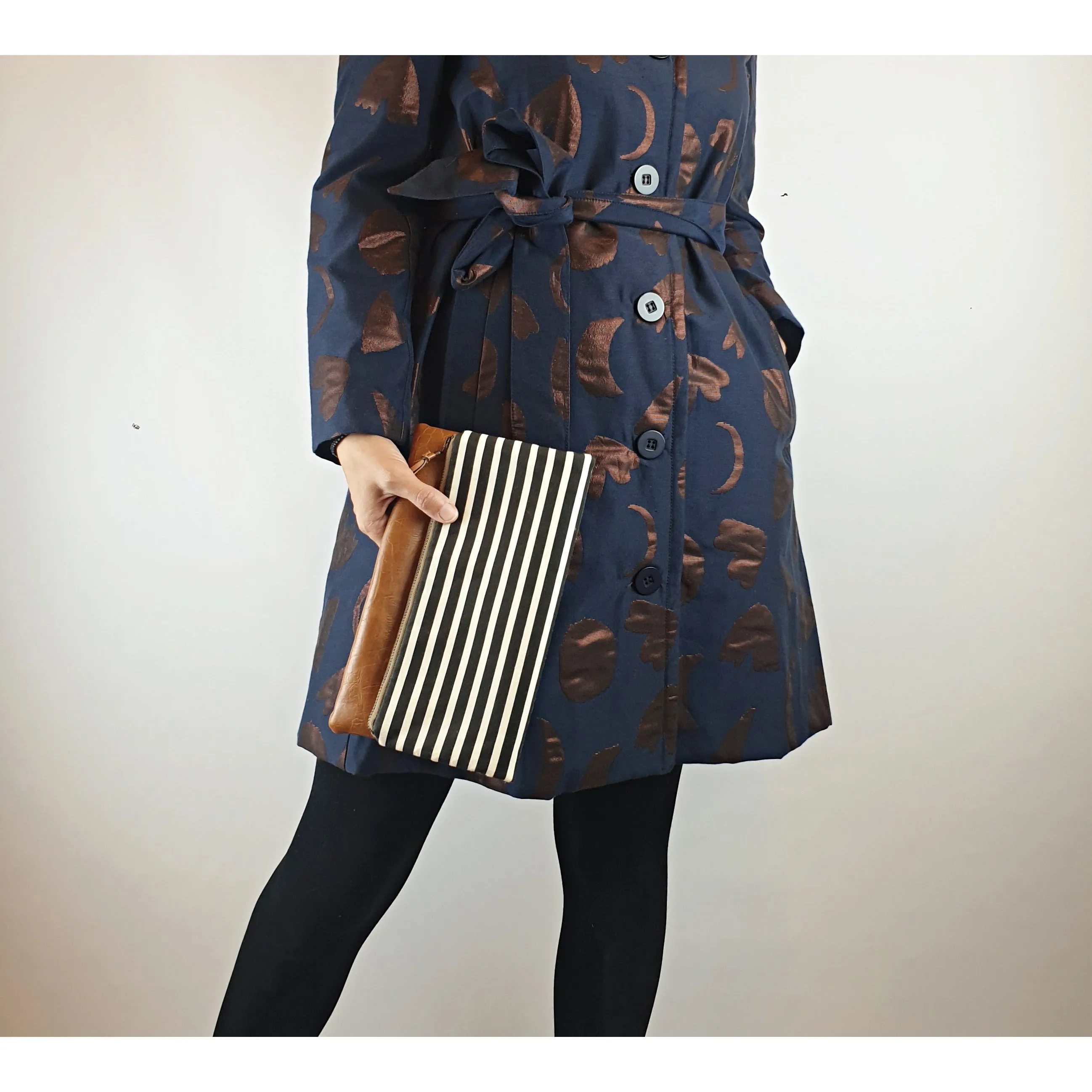 Maddie Kay brown faux leather foldover clutch with navy and white striped fabric
