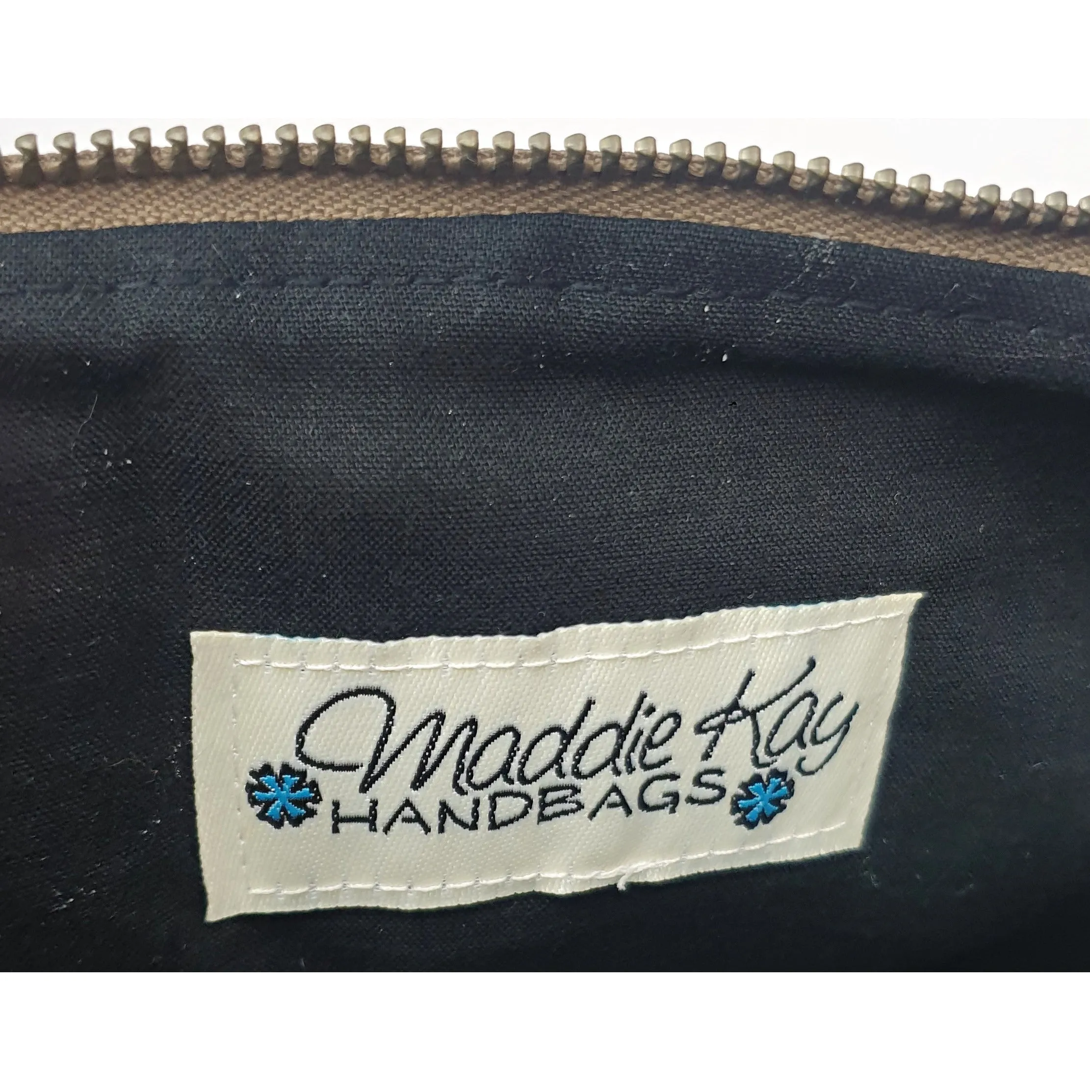 Maddie Kay brown faux leather foldover clutch with navy and white striped fabric