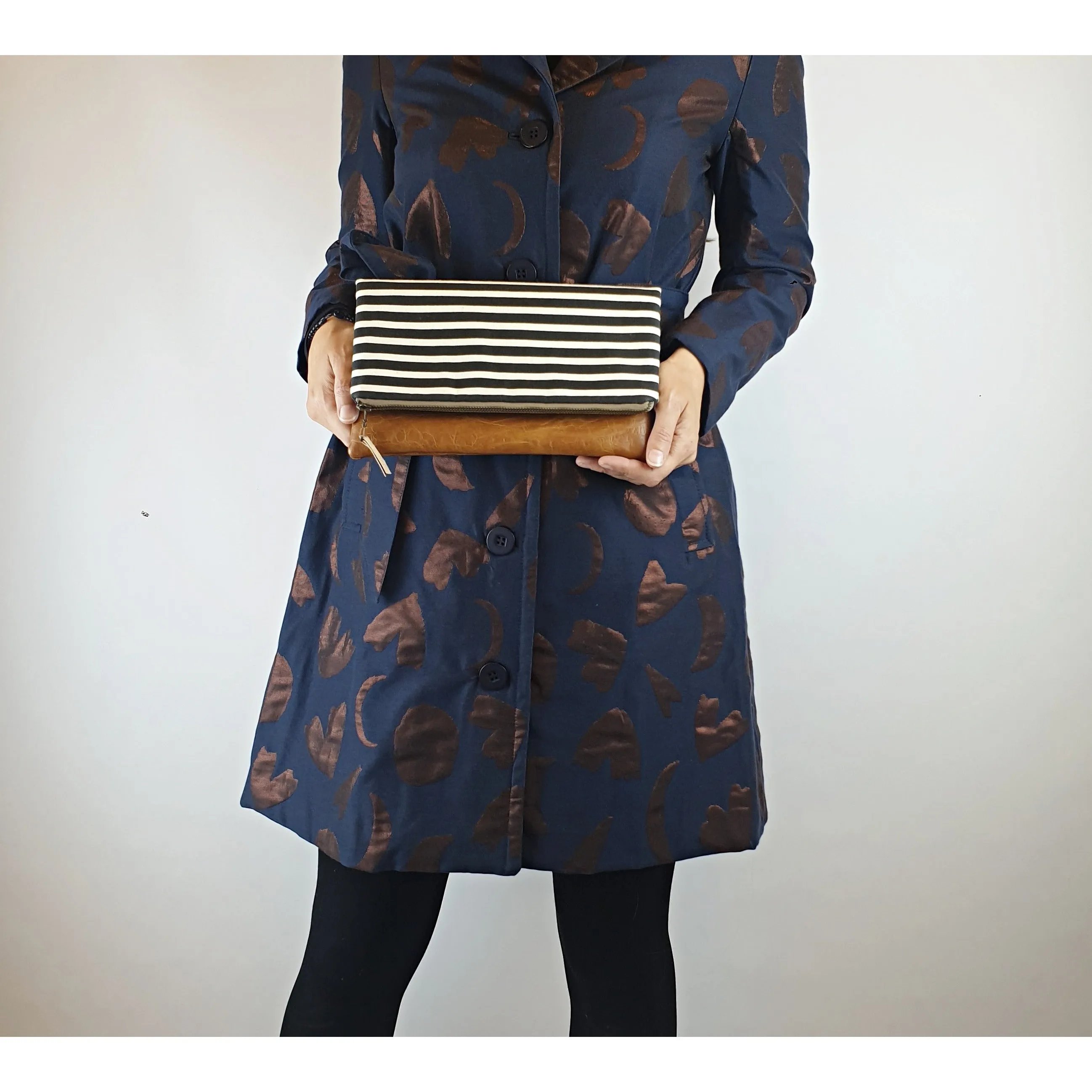 Maddie Kay brown faux leather foldover clutch with navy and white striped fabric