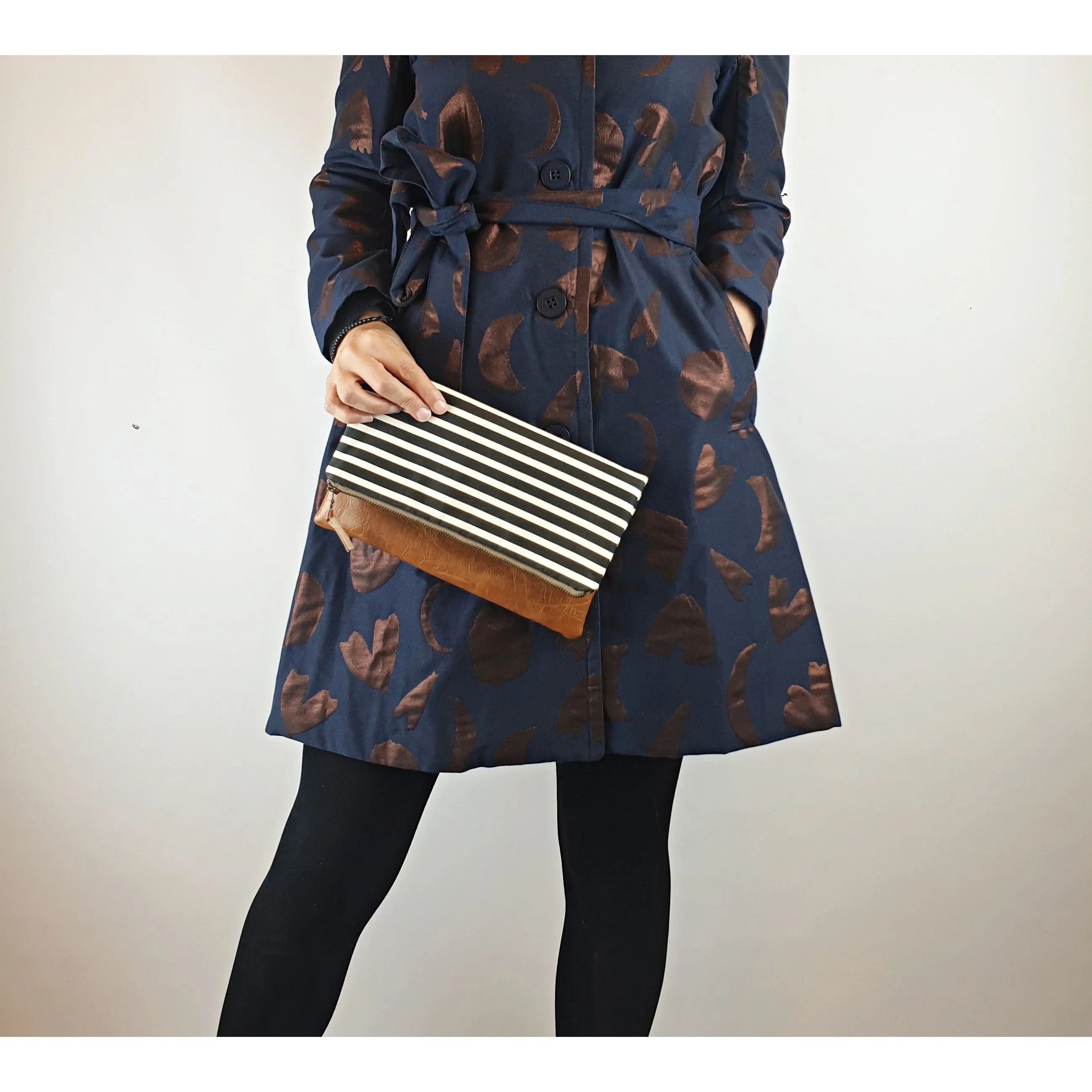 Maddie Kay brown faux leather foldover clutch with navy and white striped fabric